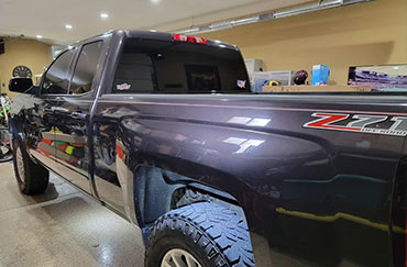 The tinted back window of a truck