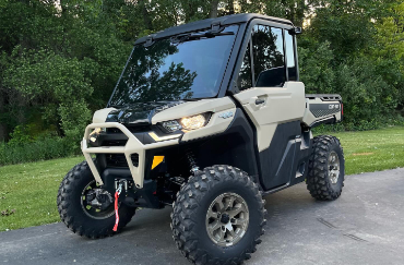 A Can-Am Defender with tinted front and side windows