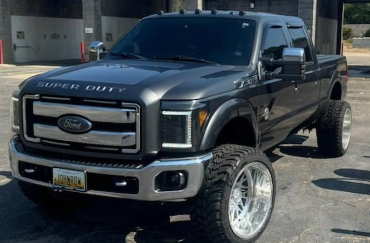 A Super Duty Ford truck with tinted windows